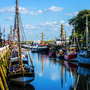 Büsumer Hafen bei blauen Himmel mit Wolken